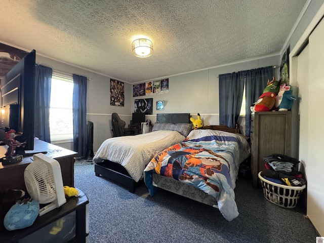 bedroom featuring a textured ceiling and carpet floors