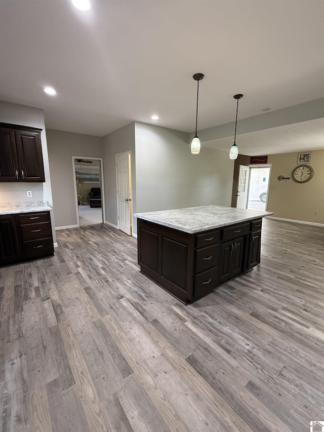 1040 Lone Valley Rd, Calvert City, KY 42029 - kitchen featuring light wood finished floors, baseboards, a center island, and recessed lighting