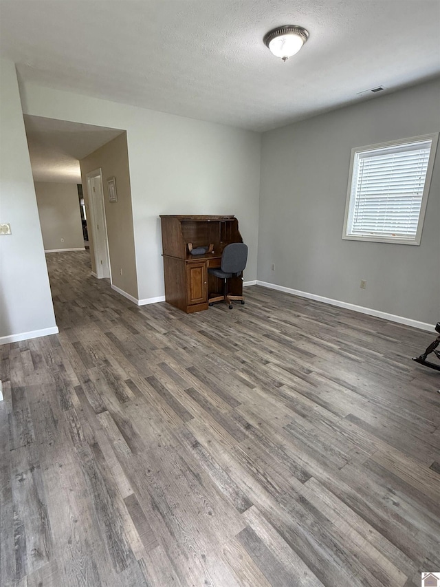 1040 Lone Valley Rd, Calvert City, KY 42029 - unfurnished office featuring wood finished floors and baseboards