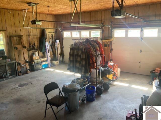 107 Monroe, Fancy Farm, KY 42039 - garage featuring wooden walls and a garage door opener