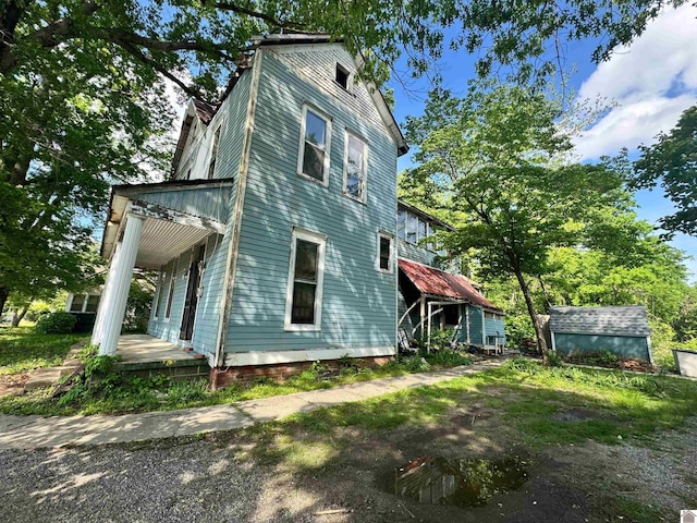 view of property exterior featuring covered porch