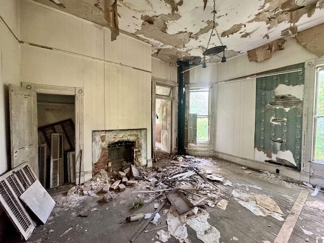 miscellaneous room with plenty of natural light and a fireplace