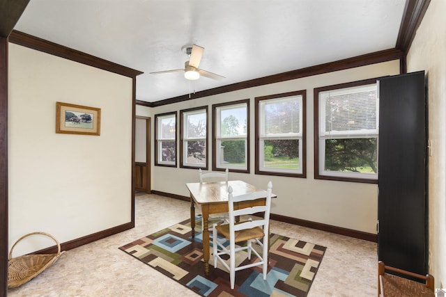 dining area featuring crown molding, ceiling fan, baseboards, and light colored carpet