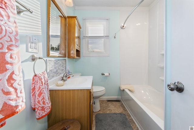 full bathroom with vanity, baseboards, toilet, and shower / washtub combination
