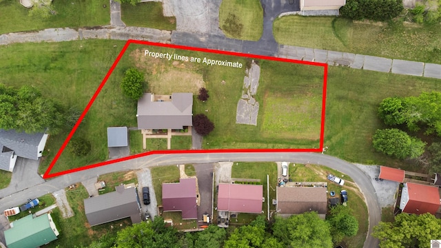 aerial view of property and surrounding area with property boundaries highlighted