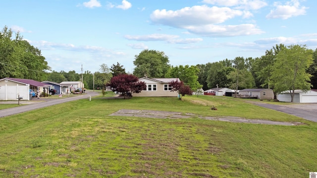 view of front of home with a front yard and a residential view