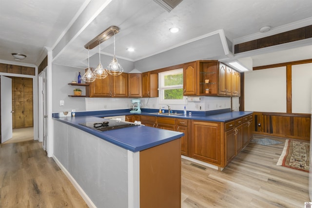 kitchen featuring open shelves, black electric stovetop, brown cabinets, dark countertops, and ornamental molding