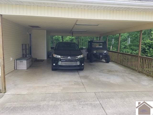 6576 Blue Springs Rd, Cadiz, KY 42211 - view of vehicle parking featuring a carport