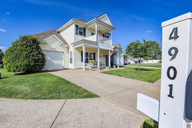 view of front of house with a balcony, a porch, a front yard, concrete driveway, and an attached garage