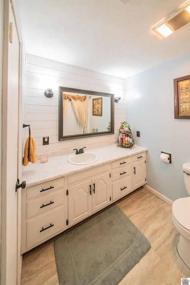 2782 Foust Sledd Rd, Benton, KY 42025 - bathroom with toilet, vanity, and baseboards