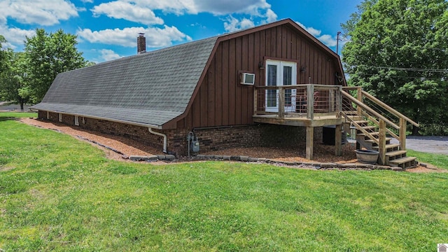 2782 Foust Sledd Rd, Benton, KY 42025 - view of property exterior featuring a gambrel roof, a yard, a chimney, and french doors