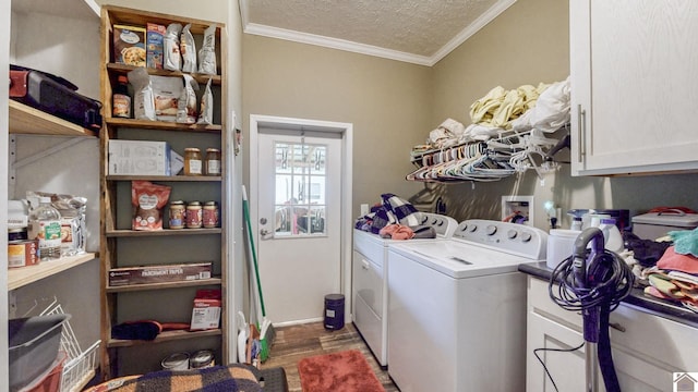laundry area featuring washer and clothes dryer, crown molding, wood finished floors, cabinet space, and a textured ceiling