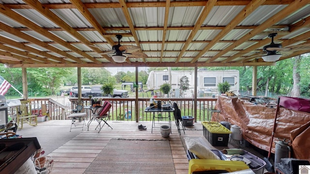 wooden deck featuring ceiling fan