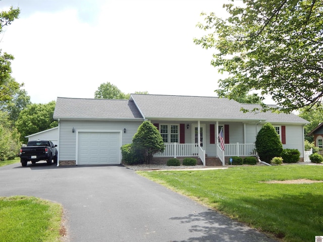 222 Ash St, Benton, KY 42025 - ranch-style home featuring a porch, an attached garage, a front yard, driveway, and a shingled roof