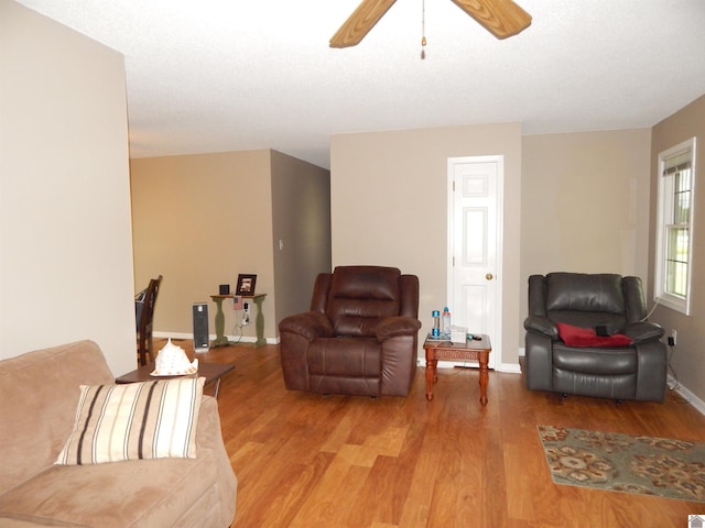 222 Ash St, Benton, KY 42025 - living room with light wood-style flooring, ceiling fan, and baseboards