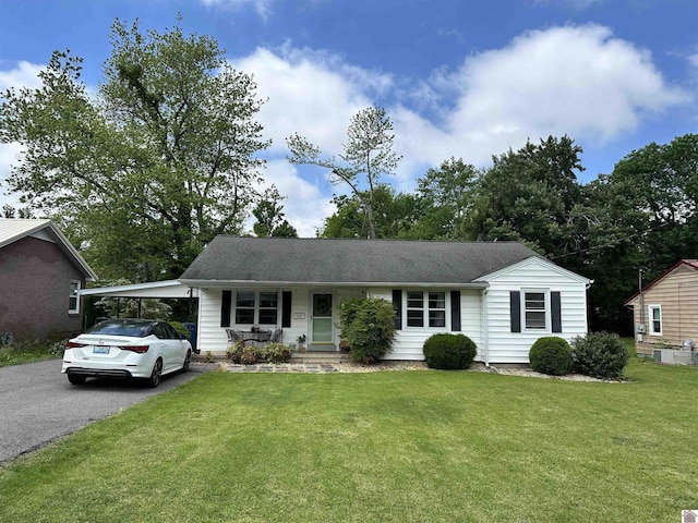 203 N 17th, Murray, KY 42071 - single story home with driveway, a front lawn, a porch, and an attached carport