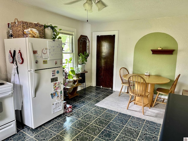 203 N 17th, Murray, KY 42071 - dining area with ceiling fan, a textured wall, and a textured ceiling