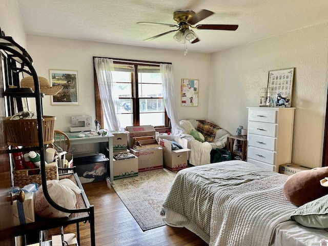 203 N 17th, Murray, KY 42071 - bedroom with wood finished floors, a textured wall, a textured ceiling, and a ceiling fan