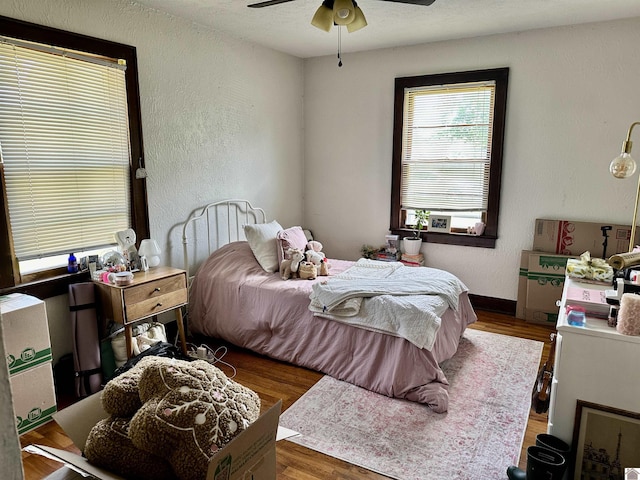203 N 17th, Murray, KY 42071 - bedroom with a textured wall, wood finished floors, and a ceiling fan
