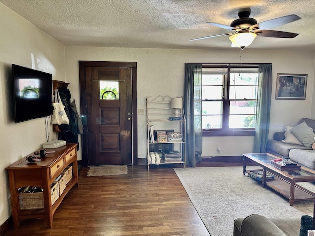 203 N 17th, Murray, KY 42071 - living area featuring a textured ceiling, a ceiling fan, wood finished floors, and baseboards
