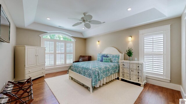 171 Cagel, Gilbertsville, KY 42044 - bedroom featuring a tray ceiling, wood finished floors, ceiling fan, and recessed lighting