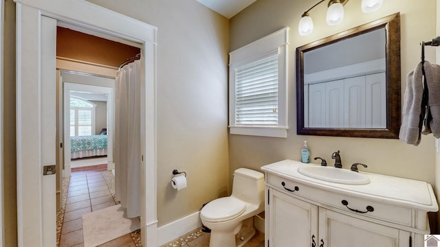171 Cagel, Gilbertsville, KY 42044 - full bath with toilet, tile patterned flooring, vanity, baseboards, and connected bathroom