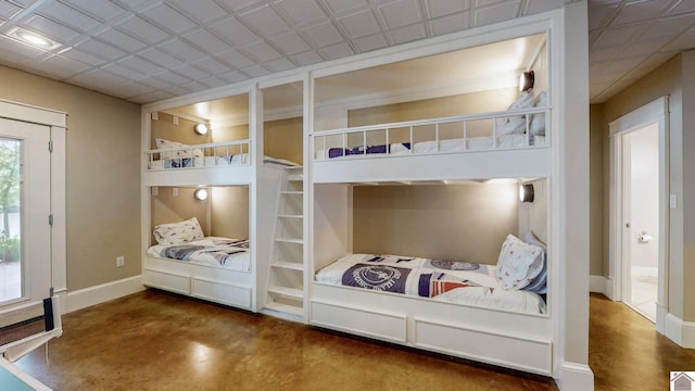 171 Cagel, Gilbertsville, KY 42044 - bedroom with finished concrete floors and baseboards