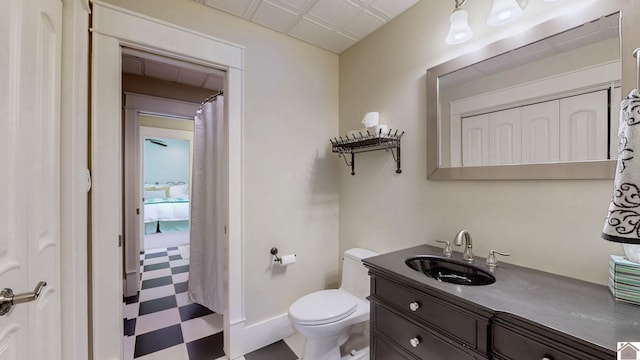171 Cagel, Gilbertsville, KY 42044 - bathroom featuring tile patterned floors, toilet, vanity, and baseboards