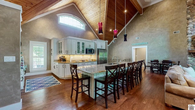 171 Cagel, Gilbertsville, KY 42044 - kitchen with stainless steel appliances, high vaulted ceiling, dark wood-style floors, plenty of natural light, and wooden ceiling