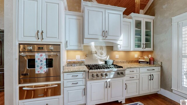 171 Cagel, Gilbertsville, KY 42044 - kitchen featuring stainless steel appliances, a warming drawer, dark wood finished floors, white cabinetry, and glass insert cabinets