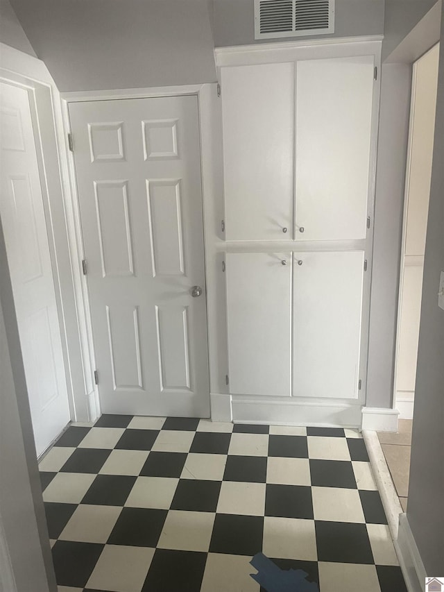 corridor featuring tile patterned floors
