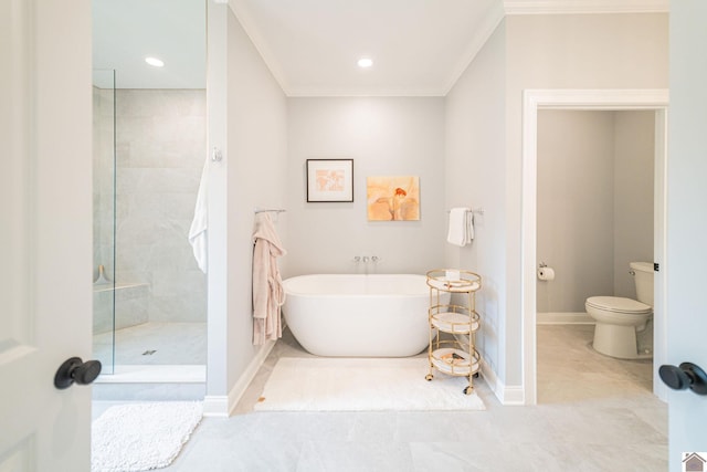 112 Shadow Pine Ln, Paducah, KY 42001 - bathroom with toilet, tiled shower, a freestanding tub, baseboards, and ornamental molding