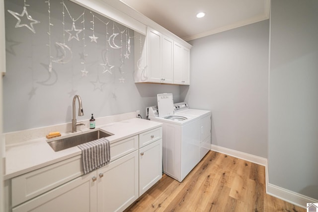 112 Shadow Pine Ln, Paducah, KY 42001 - washroom with cabinet space, washer and dryer, crown molding, light wood finished floors, and baseboards