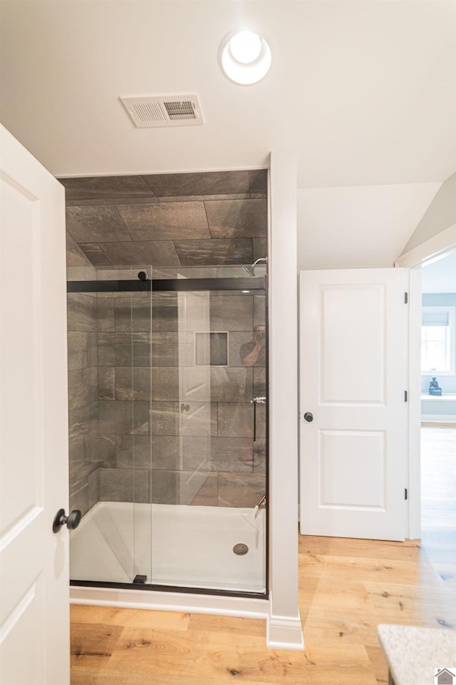 112 Shadow Pine Ln, Paducah, KY 42001 - full bathroom with a shower stall, wood finished floors, and vaulted ceiling