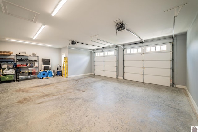 112 Shadow Pine Ln, Paducah, KY 42001 - garage featuring a garage door opener and baseboards