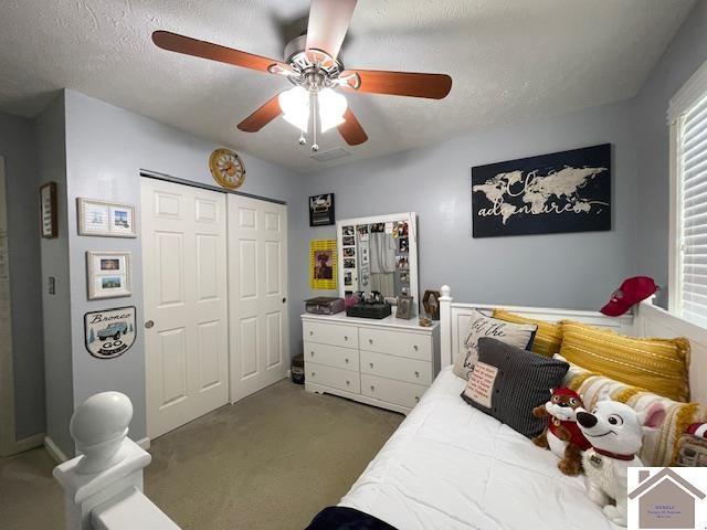 695 Heritage Trce, Cadiz, KY 42211 - carpeted bedroom with a closet, a ceiling fan, and a textured ceiling