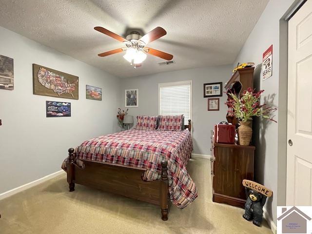 695 Heritage Trce, Cadiz, KY 42211 - carpeted bedroom with baseboards, a textured ceiling, and ceiling fan