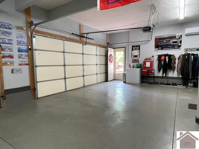 695 Heritage Trce, Cadiz, KY 42211 - garage featuring an AC wall unit and a garage door opener