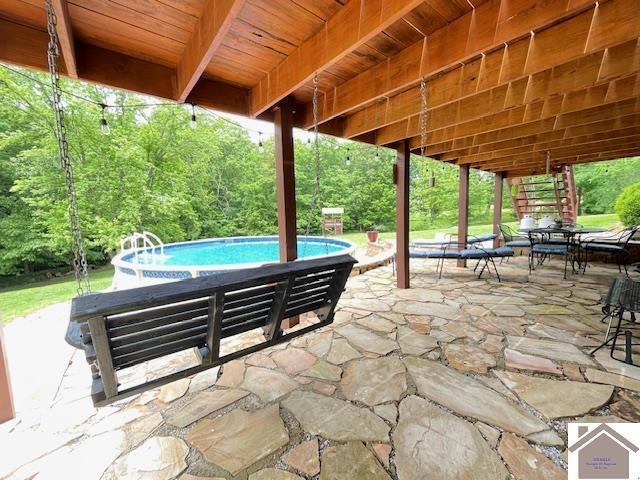 695 Heritage Trce, Cadiz, KY 42211 - view of patio with an outdoor pool and outdoor dining space