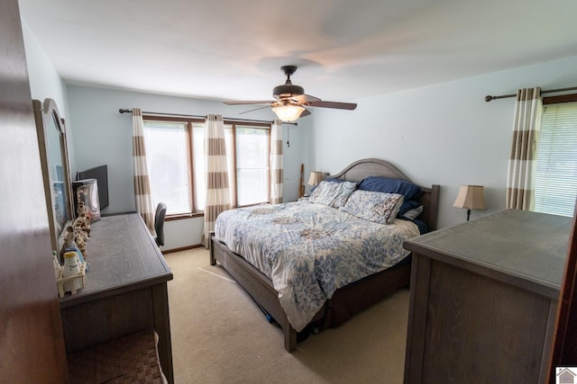 bedroom with light colored carpet and ceiling fan