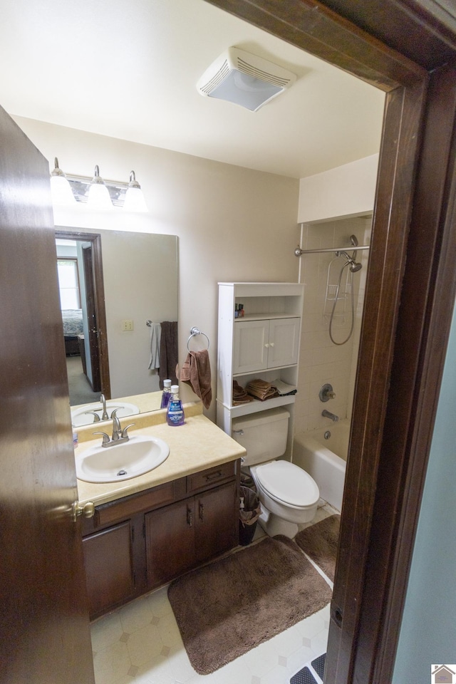 full bath with vanity, bathing tub / shower combination, tile patterned floors, and toilet