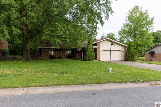 view of front facade with concrete driveway, brick siding, and a front yard