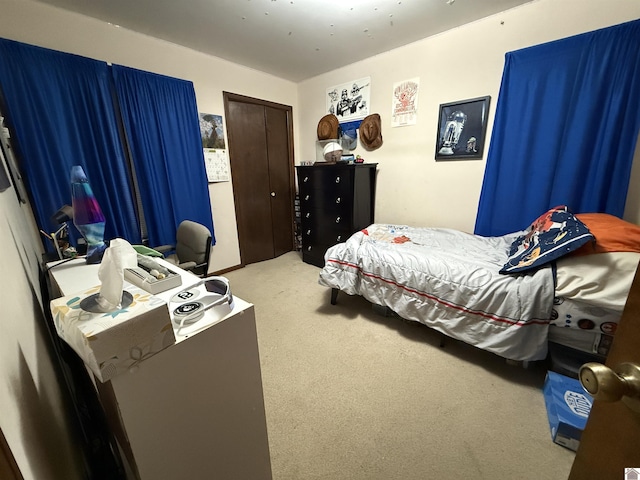 carpeted bedroom featuring a closet