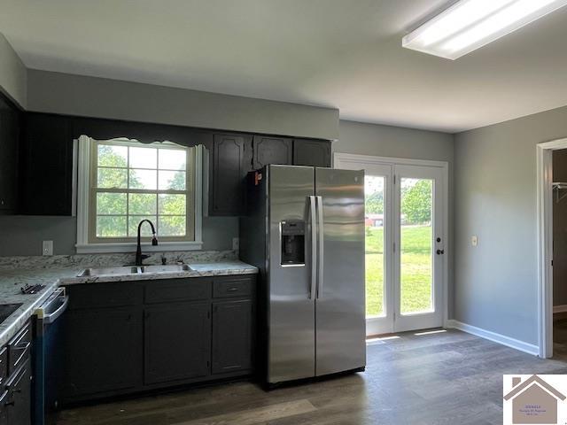 197 Briarfield Ln, Cadiz, KY 42211 - kitchen featuring stainless steel fridge, a sink, wood finished floors, and light stone countertops