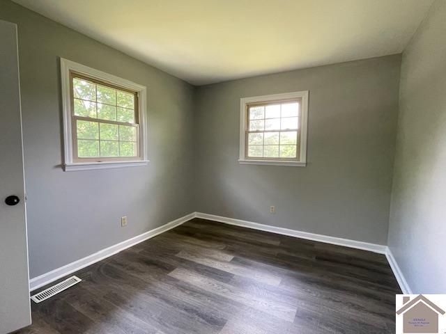 197 Briarfield Ln, Cadiz, KY 42211 - empty room with dark wood-type flooring and baseboards
