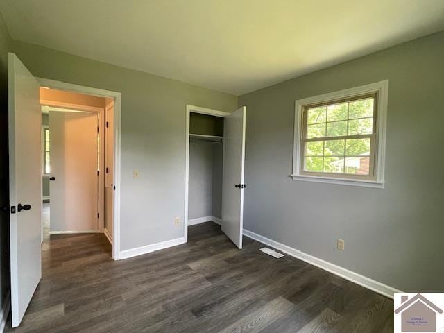 197 Briarfield Ln, Cadiz, KY 42211 - unfurnished bedroom featuring baseboards, dark wood-style floors, and a closet