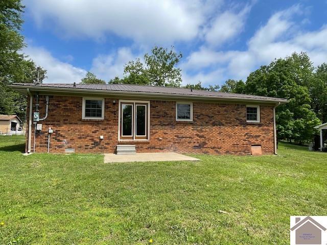 197 Briarfield Ln, Cadiz, KY 42211 - rear view of property featuring a lawn, a patio area, brick siding, and crawl space
