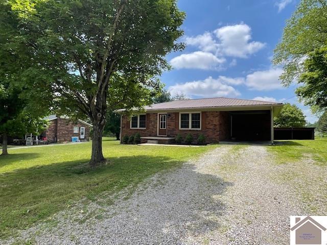 197 Briarfield Ln, Cadiz, KY 42211 - ranch-style home featuring driveway, a front lawn, and metal roof