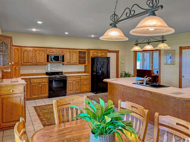 730 Rob Mason Rd, Murray, KY 42071 - kitchen with black appliances, a sink, brown cabinets, tile countertops, and recessed lighting