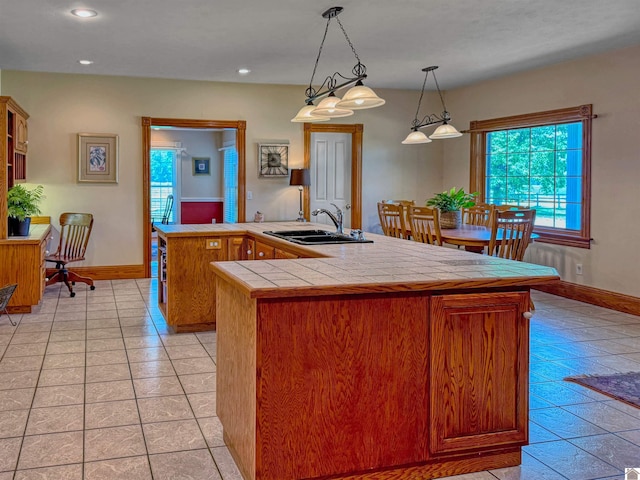 730 Rob Mason Rd, Murray, KY 42071 - kitchen featuring a sink, tile counters, a kitchen island, baseboards, and recessed lighting